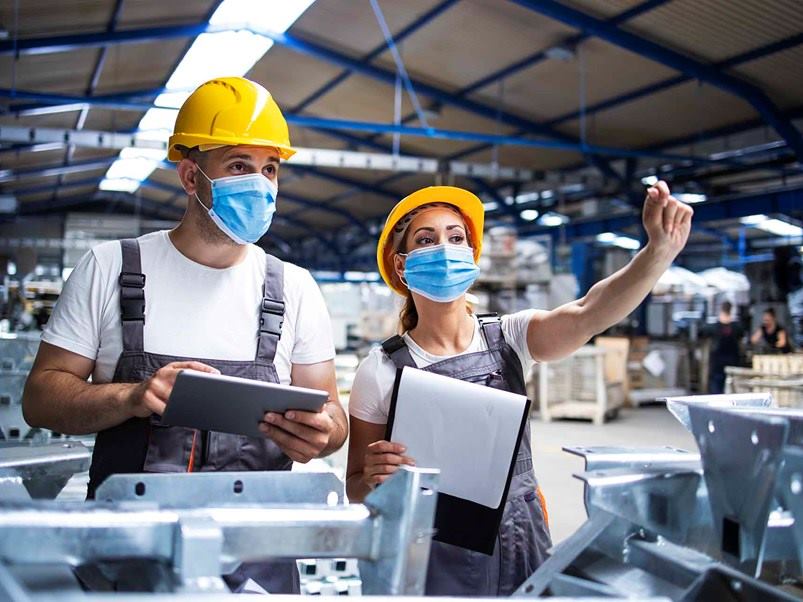 factory-workers-with-face-masks-protected-against-corona-virus-doing-quality-control-of-production-in-factory